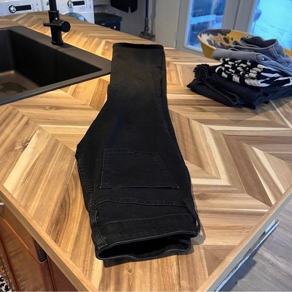 Levi's stretchy black boot cut jean size 27" inseam is 32". - Picture 8 of 9